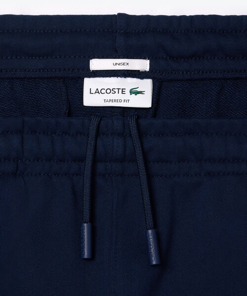 「LACOSTE」 スウェットパンツ L ワイン メンズの画像