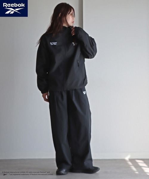 ワイドパンツ パンツ 「Reebok/リーボック」 別注 スモールベクター刺繍ナイロンパンツ レディース メンズの画像