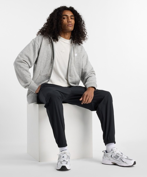 New Balance スウェットパンツ ジャージ ウーブントラックス