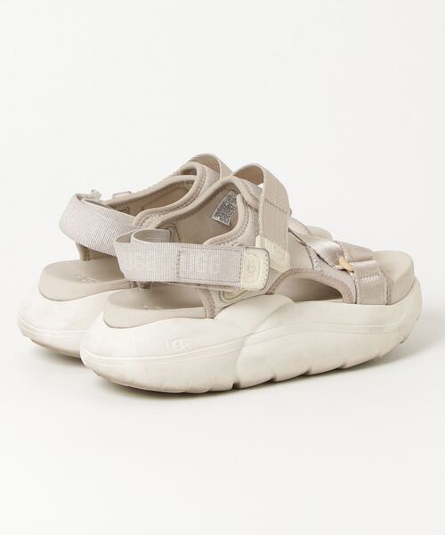 UGG サンダル ベージュ ストラップ UGG Australia（アグオーストラリア） 「UGG」 フラットサンダル 23.5