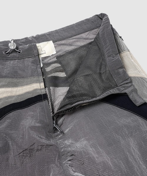 ERL（イーアールエル） パンツ UNISEX NYLON RAVE PANTS WOVEN メンズ