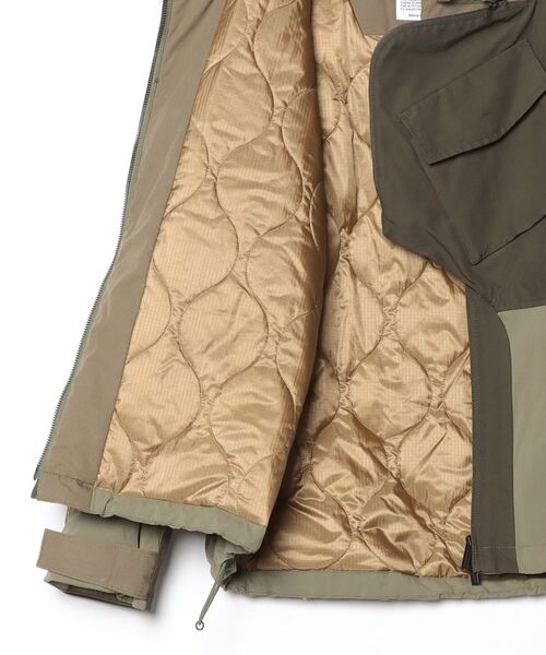 コート ジャケット 「WhiteMoutaineering」ホワイトマウンテイニアリング WM × NEXUSVII ASYMETRY JACKETの画像