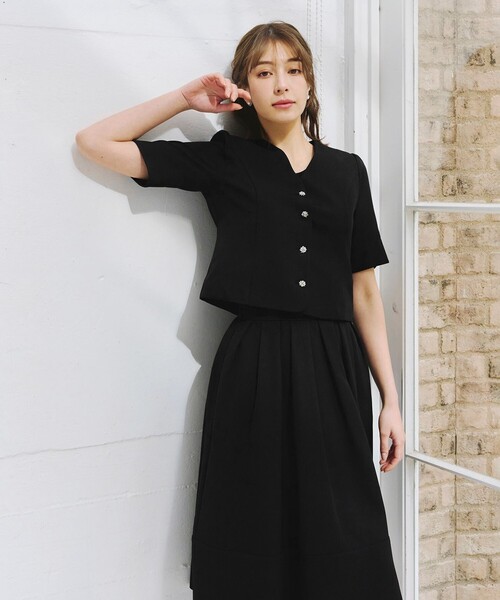 リボン付きブラックニットとプリーツスカート Twinkle;pm（トゥインクルピーエム）の「リボン付きプリーツミニ