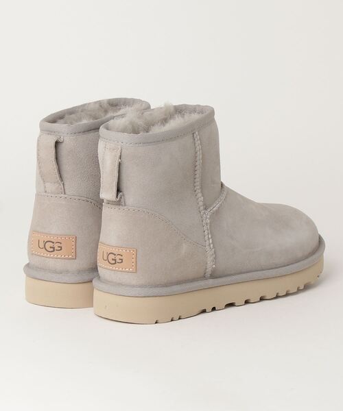 新品未使用UGGライトグレー光沢感ありムートンブーツ 大きいストーン付きかわいい UGG Australia（アグオーストラリア） 「UGG」 ムートンブーツ 24.0cm