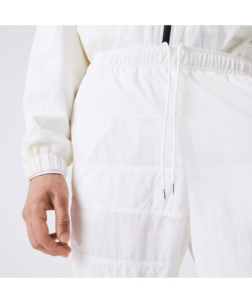 LACOSTE パンツ アシンメトリーパッチワークトラックパンツ