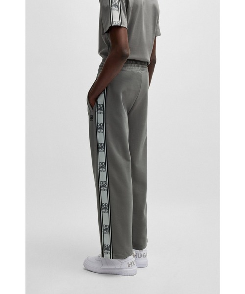 かっこいい【Hugo Boss】×Red Bull テープロゴ トラックパンツ HUGO - HUGO x RB oversized-fit trousers with tape and